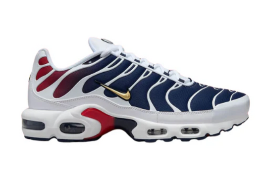 Nike Air Max Plus x PSG collaboration sneakers – white mesh upper with navy‑blue and red gradient, gold Swoosh, PSG crest on tongue, ‘ICI C’EST PARIS’ detailing and Tuned Air cushioning"